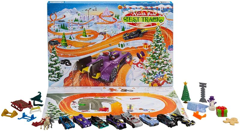 Photo 1 of Hot Wheels 2021 Advent Calendar with 24 Surprises That Include 8 1:64 Scale Vehicles & Other Cool Accessories, Plus a Play Pane Mat, for Collectors & Kids 3 Years Old & Up
