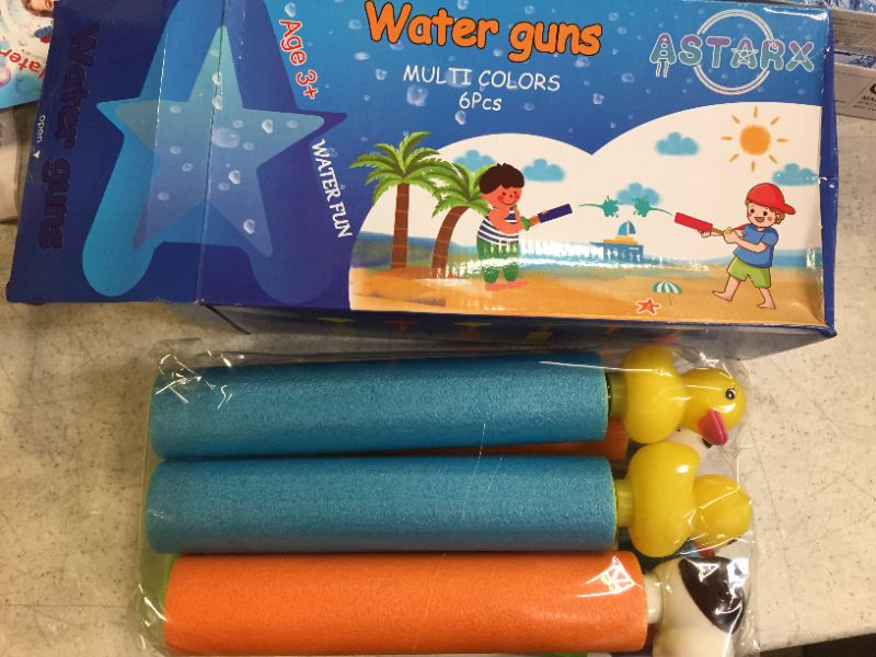 Photo 3 of 2 packs of water squirt guns, 8 squirt guns total