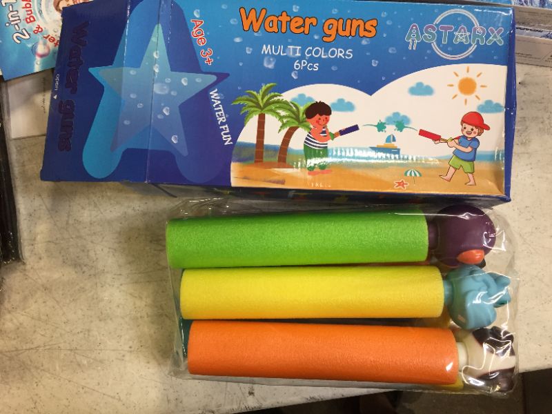 Photo 2 of 2 packs of water squirt guns, 8 squirt guns total