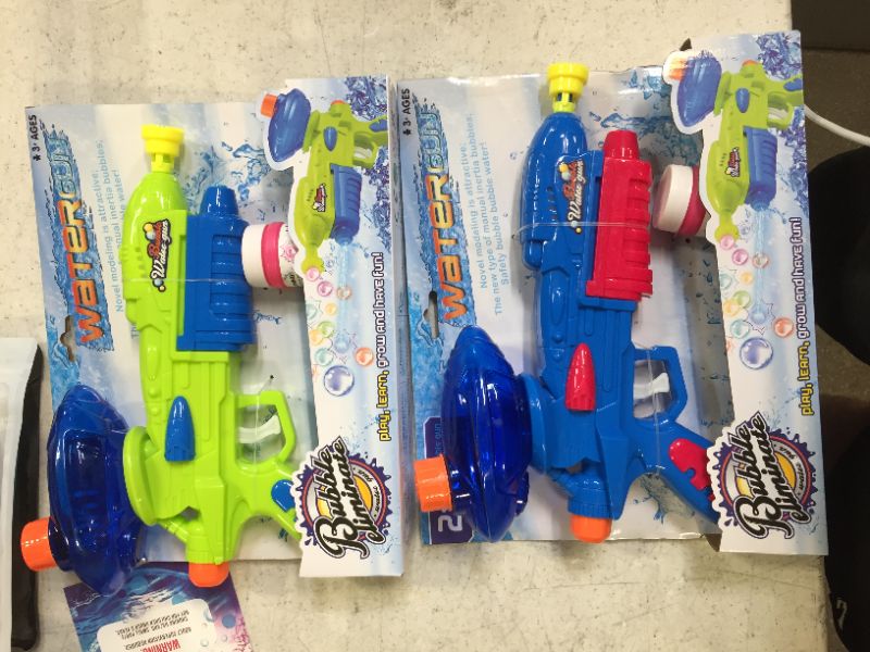 Photo 1 of 2 packs of water squirt guns, 8 squirt guns total