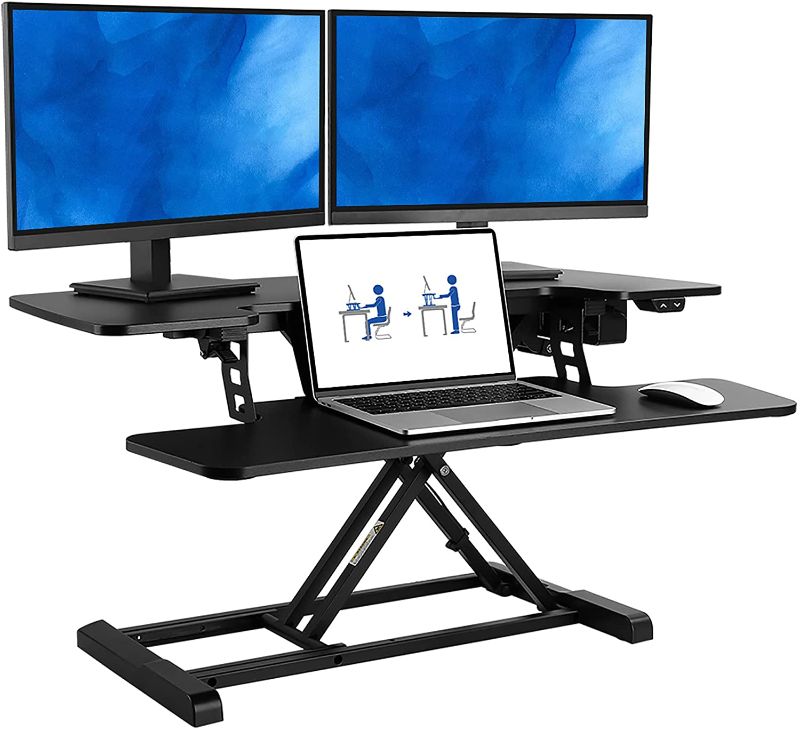 Photo 1 of FlexiSpot Motorized Standing Desk Converter 36" Wide Electric Stand up Desk Riser for Monitor and Laptop,Black Height Adjustable Desk for Home Office EM7MBM MINOR DAMAGE
