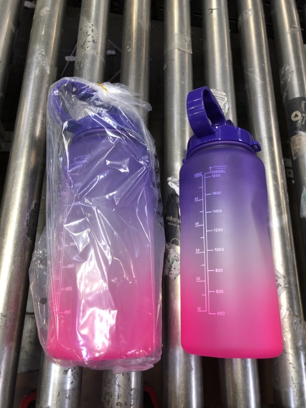 Photo 1 of 2 PACK 64OZ WATER BOTTLES. COLOR PURPLE PINK.