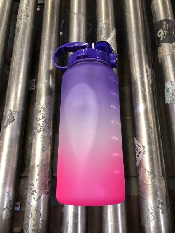 Photo 1 of 2 PACK 64OZ WATER BOTTLES. COLOR PURPLE PINK.