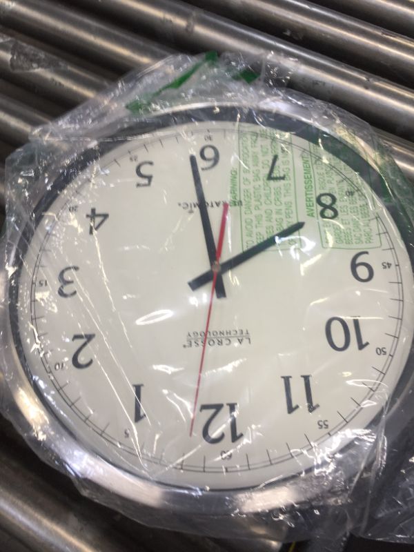 Photo 2 of La Crosse Technology 404-1235ua-ss 14 inch UltrAtomic Analog Stainless Steel Wall Clock----clock hands are loose 