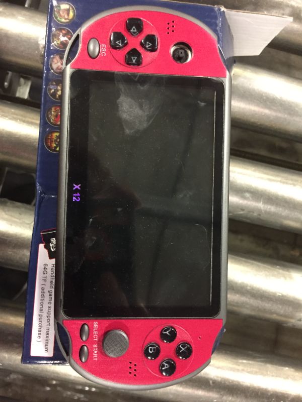 Photo 1 of handheld console with games included-- knock off brand 