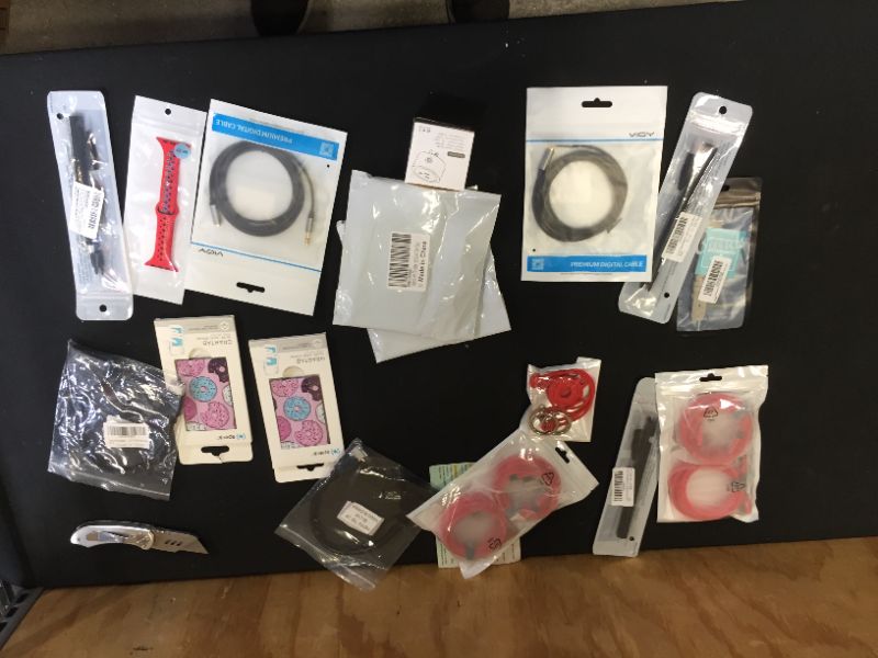 Photo 2 of Assorted technology accessories (smartwatch bands, cables, charging cords) 