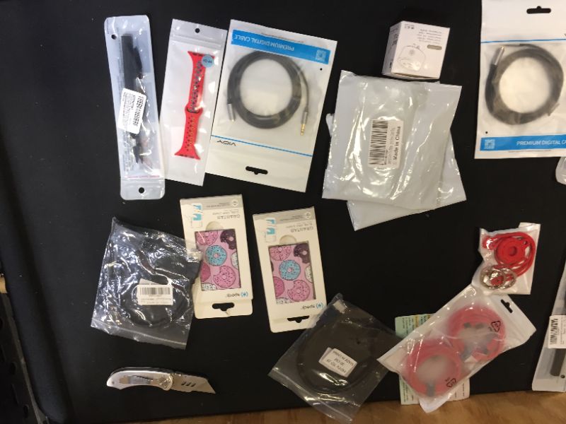 Photo 3 of Assorted technology accessories (smartwatch bands, cables, charging cords) 