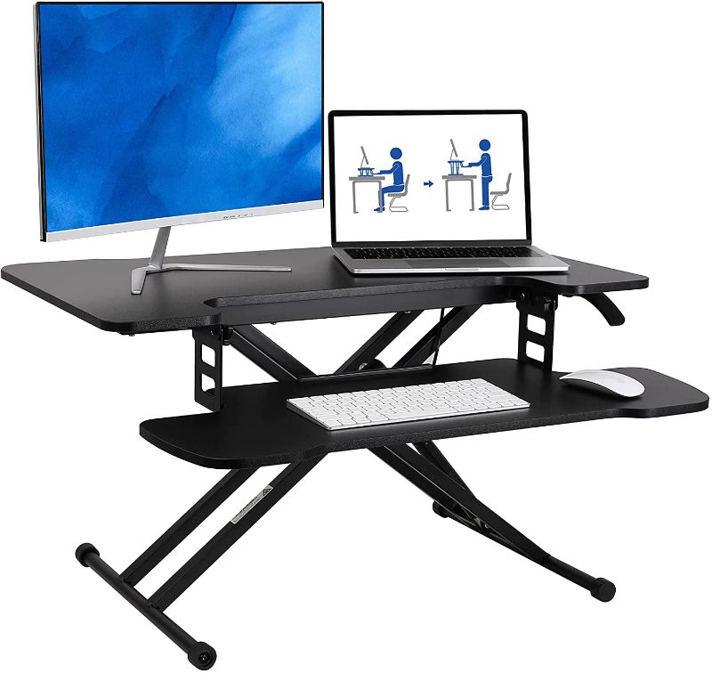 Photo 1 of FLEXISPOT 31 inch Standing Desk Converter | Height Adjustable Stand Up Desk Riser, Black Home Office Desk Laptop Workstation with Removable Keyboard Tray (M18M)
