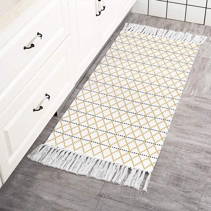 Photo 1 of Boho Kitchen Rug, Hand Woven Accent Rug with Tassels, Oriental Morrocan Tribal Geometric Washable Bath Mats for Bedroom Entryway Laundry Room Indoor Outdoor Area Rugs, 2 x 4ft/Yellow White
