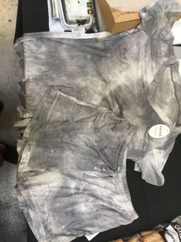 Photo 1 of Women's grey tie dye shirt and shorts size medium and workout shorts size medium and one 17x17in throw pillow case