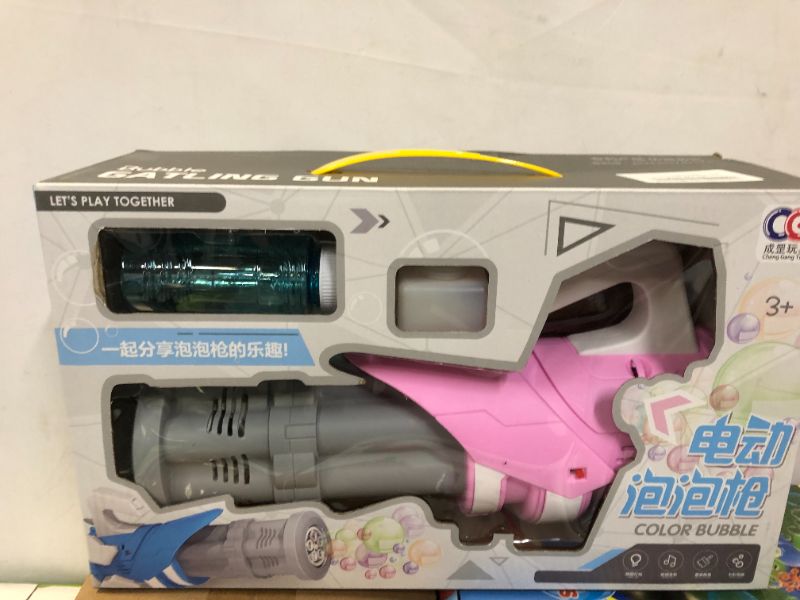 Photo 1 of HNSANMU GATLING BUBBLE MACHINE FOR KIDS (DAMAGES TO BOX)