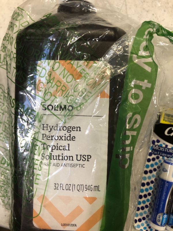 Photo 2 of Amazon Brand - Solimo Hydrogen Peroxide Topical Solution USP with chapstick 2 pack 3 each 