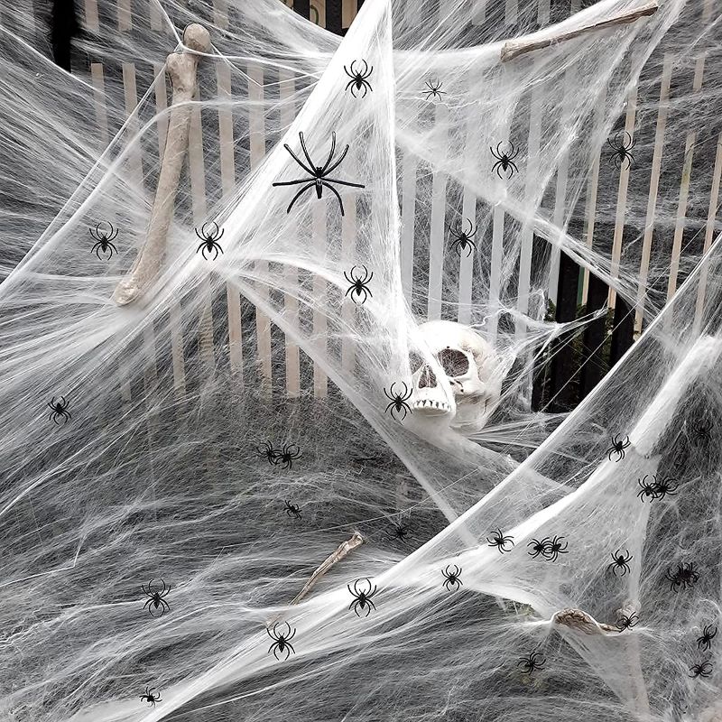 Photo 1 of AJDSK Halloween Decorations Spider Web 1400 Sqft with 200 Fake Spiders, Large Halloween Outdoor Indoor Party Yard Decor Supplies for Bar Haunted House Clearance