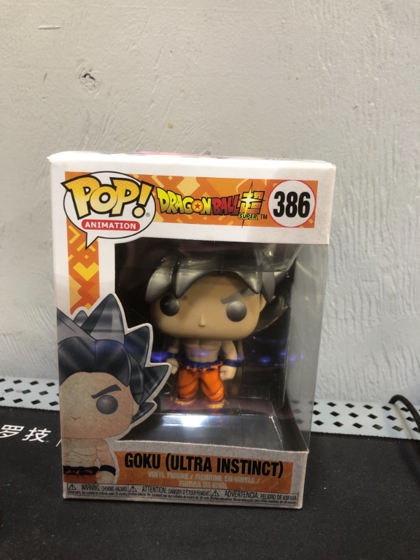 Photo 2 of Funko Pop Animation: Dragonball Super - Goku Ultra Instinct Form Collectible Figure, Multicolor, Standard (MAJOR DAMAGES TO BOX)