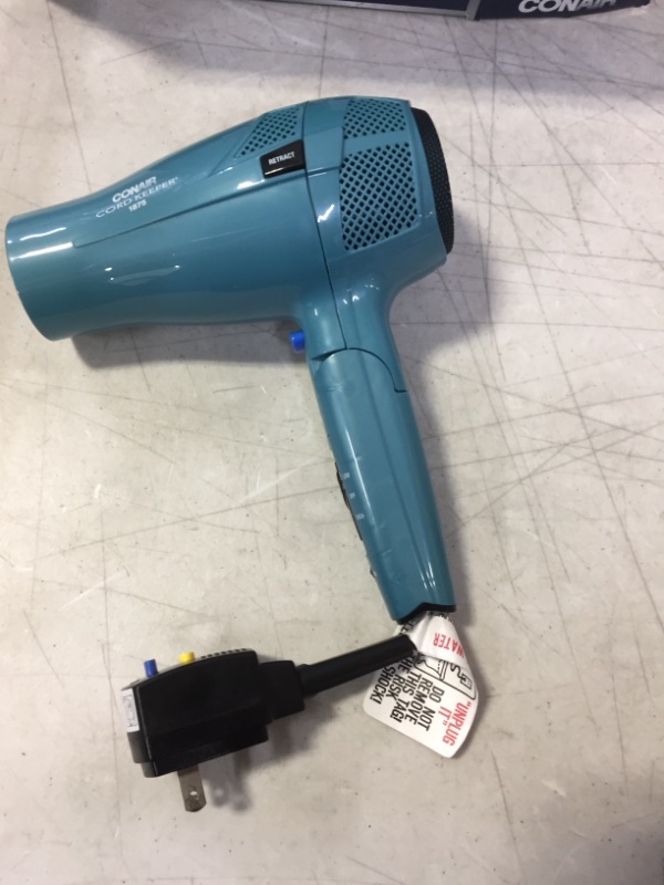 Photo 2 of Conair 1875 Watt Cord Keeper Travel Hair Dryer with Folding Handle and Retractable Cord Teal, Blue (DAMAGES TO PACKAGING)