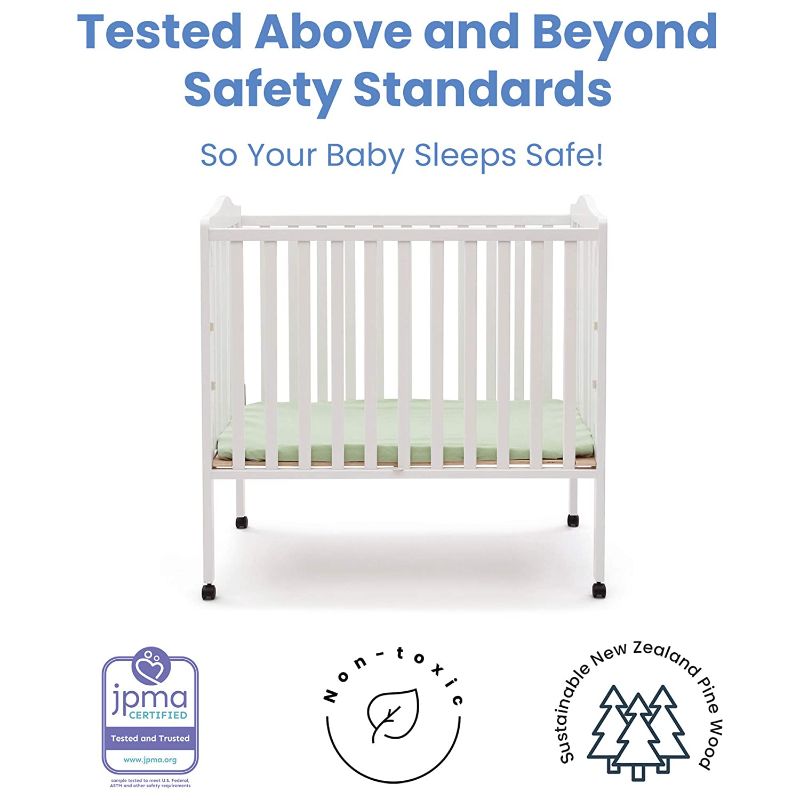 Photo 2 of Delta Children Folding Portable Mini Baby Crib with 1.5-inch Mattress, White
