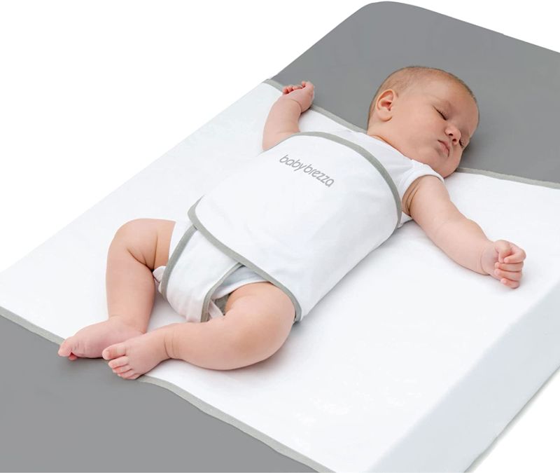 Photo 1 of Baby Brezza Safe Sleep Swaddle Blanket for Crib Safety for Newborns and Infants – Safe, Anti-Rollover Blanket in White, by Tranquilo Reste
