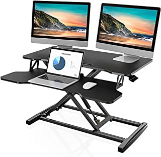 Photo 1 of FITUEYES Height Adjustable Standing Desk Converter 32” Wide Sit to Stand Desk Tabletop Workstation SD308001WB
