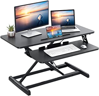 Photo 1 of Quick Sit to Stand Desktop Gas Spring Riser (Max Height:19.3inch), 33 inch Height Adjustable Standing Desk Converter for Dual Computer Monitors & Laptop Workstation, Perfect Home Office by HUANUO
