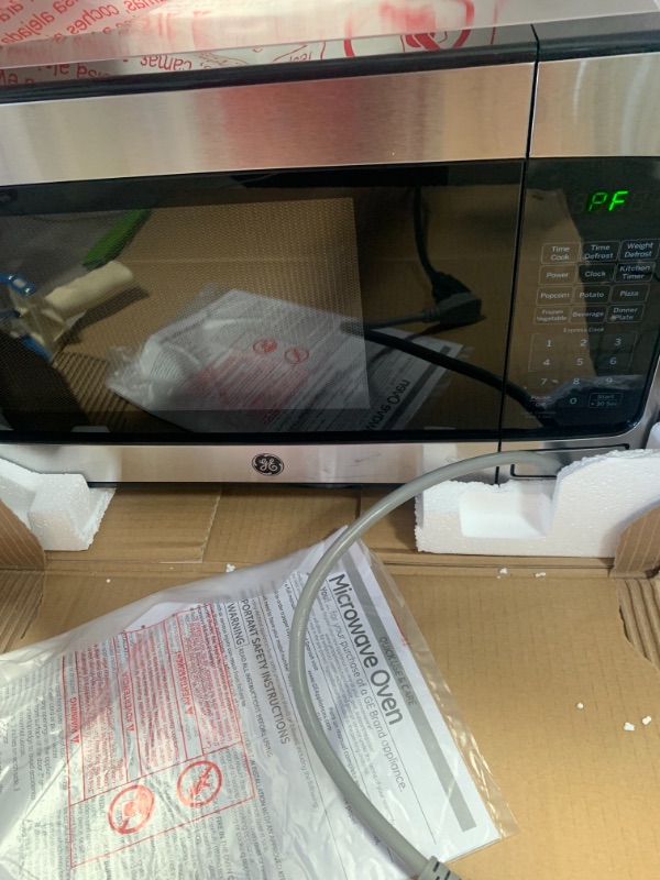 Photo 1 of GE - 1.1 Cu. ft. Mid-Size Microwave - Stainless Steel