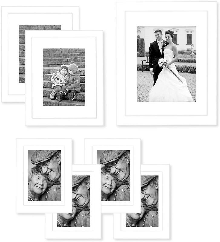 Photo 1 of Americanflat 7 Piece White Gallery Wall Picture Frame Set with Mats in 11x14, 8x10, and 5x7 - Composite Wood with Shatter Resistant Glass - Horizontal and Vertical Formats for Wall and Tabletop
