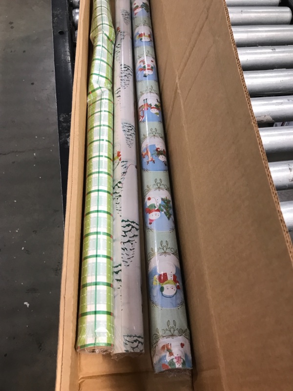 Photo 2 of (bent paper) Assorted Christmas Wrapping Paper, pack of 3 (STOCK PHOTO DOES NOT ACCURATELY REFLECT ACTUAL PRODUCT) 