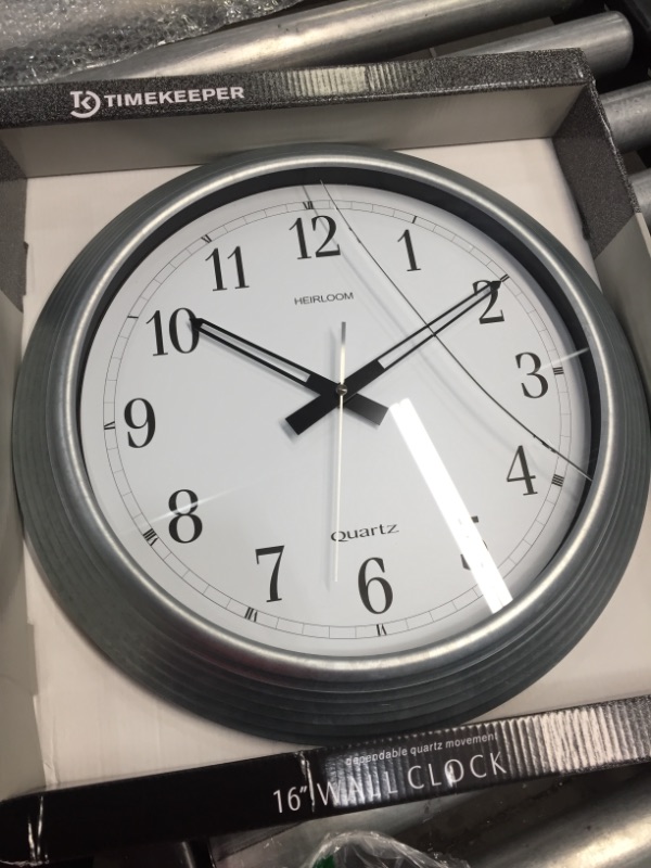 Photo 3 of Artistic, AOP401ZWA, 16" Galvanized Metal Round Wall Clock, 1
**CRACK ON FACE**