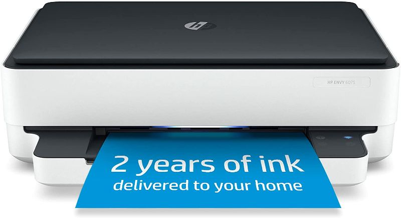 Photo 1 of HP ENVY 6075 Wireless All-in-One Printer, Includes 2 Years of Ink Delivered, Mobile Print, Scan & Copy (8QQ97A) AS IS USED, DAMAGED, MAKES WEIRD NOISE WHEN TURNED ON, LIGHT CHANGED COLOR FROM GREEN TO YELLOW , PLEASE SEE PHOTOS (INK NOT INCLUDED FOR 2 YEA