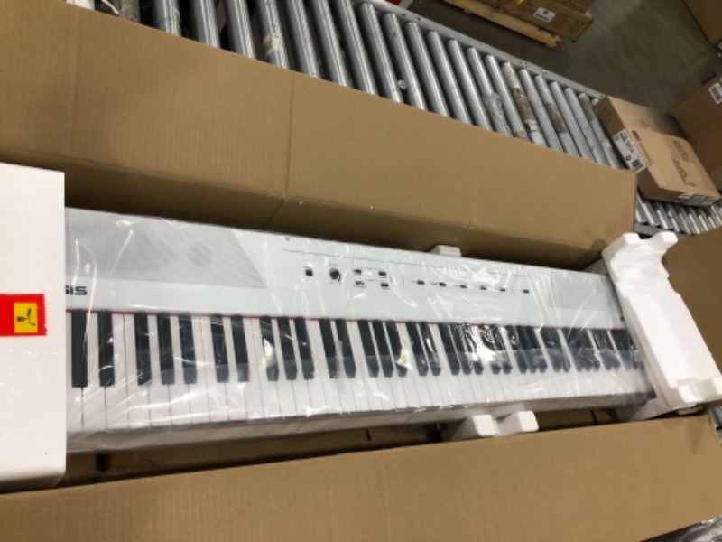 Photo 2 of Alesis Recital White | All White 88-Key Digital Piano / Keyboard with Full-Size Semi-Weighted Keys, Power Supply, Built-in Speakers and 5 Premium
unable to test