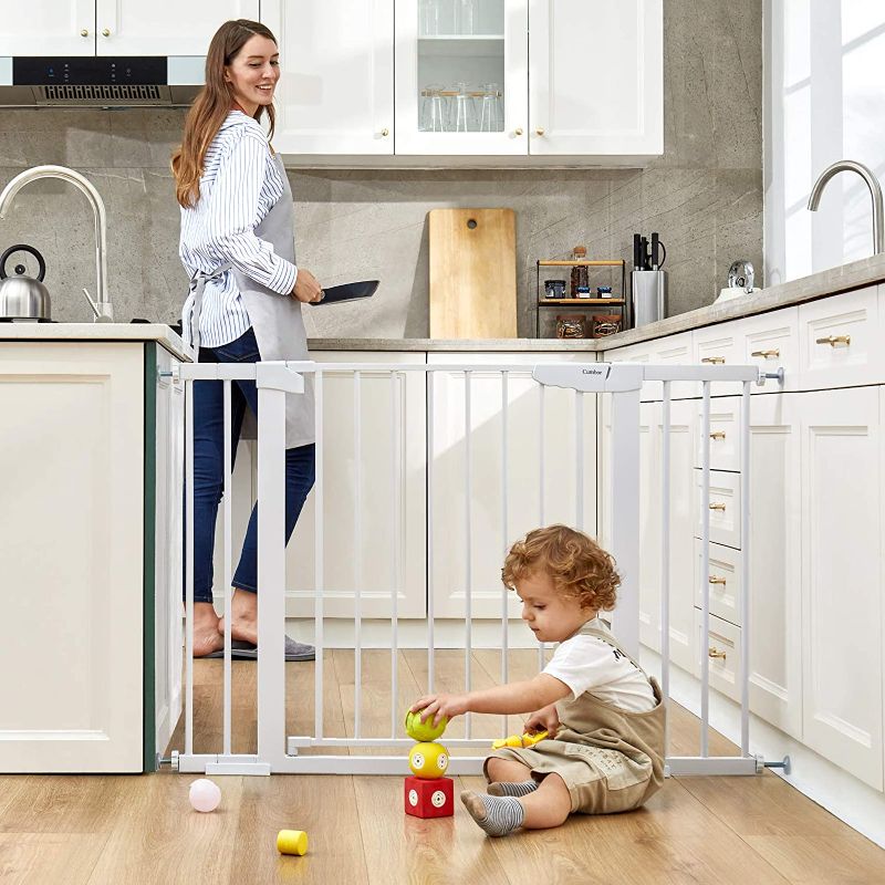 Photo 1 of Cumbor 46” Auto Close Safety Baby Gate, Extra Tall and Wide Child Gate, Easy Walk Thru Durability Dog Gate for The House, Stairs, Doorways. Includes 4 Wall Cups, 2.75-Inch and 8.25-Inch Extension
