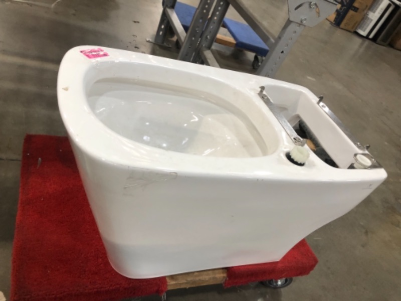 Photo 2 of ***NOT EXACT ITEM AS SEEN IN STOCK PHOTO*** PLEASE REFER TO PHOTO*** Comfort Height(R) elongated 1.28 gpf toilet with skirted trapway and Revolution 360 swirl flushing technology, White
