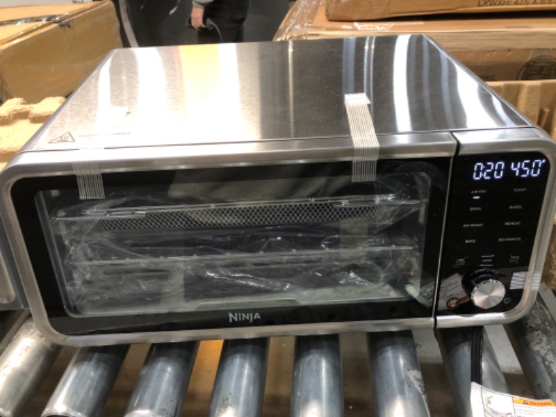 Photo 2 of TESTED FUNCTIONS PROPERLY! BRAND NEW.
Ninja SP201 Digital Air Fry Pro Countertop 8-in-1 Oven with Extended Height, XL Capacity, Flip Up & Away Capability for Storage Space, with Air Fry Basket, Wire Rack & Crumb Tray, Silver
