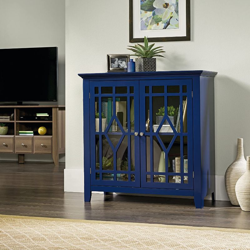 Photo 1 of **DAMAGE TO SOME WOODEN PANELS**
Sauder Shoal Creek Display Cabinet, Indigo Blue finish
