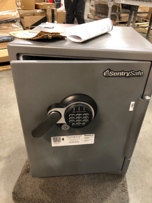 Photo 1 of SentrySafe SFW205GQC Fireproof Safe and Waterproof Safe with Dial Combination 2.05 Cubic Feet Gray/Black
//includes keys    //damaged due to shipping 