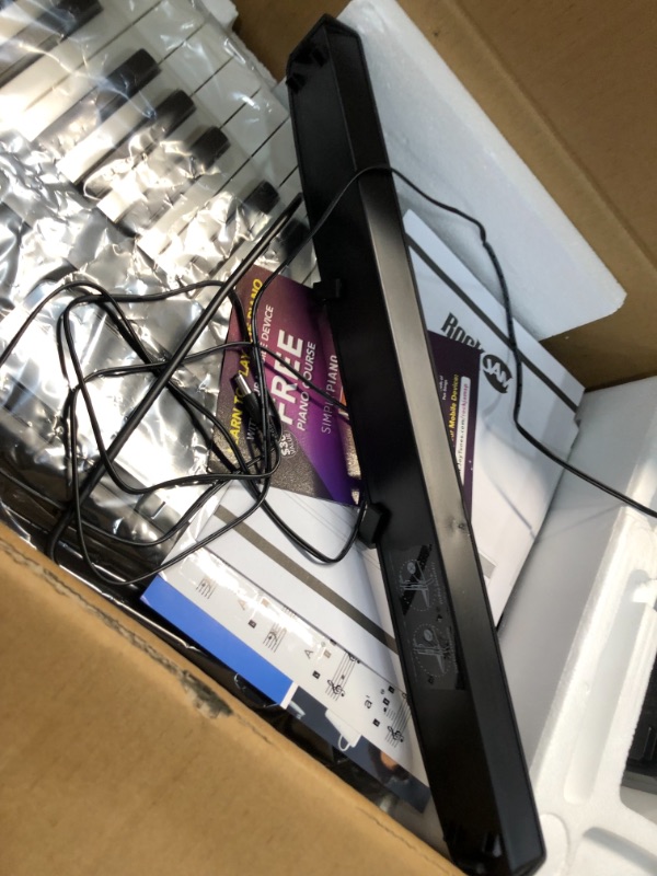 Photo 1 of RockJam 88-Key Beginner Digital Piano with Full-Size Semi-Weighted Keys, Power Supply, Simply Piano App Content & Key Note Stickers