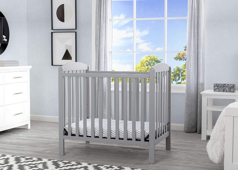 Photo 1 of Delta Children Emery Mini Convertible Baby Crib with 2.75-inch Mattress, Grey
