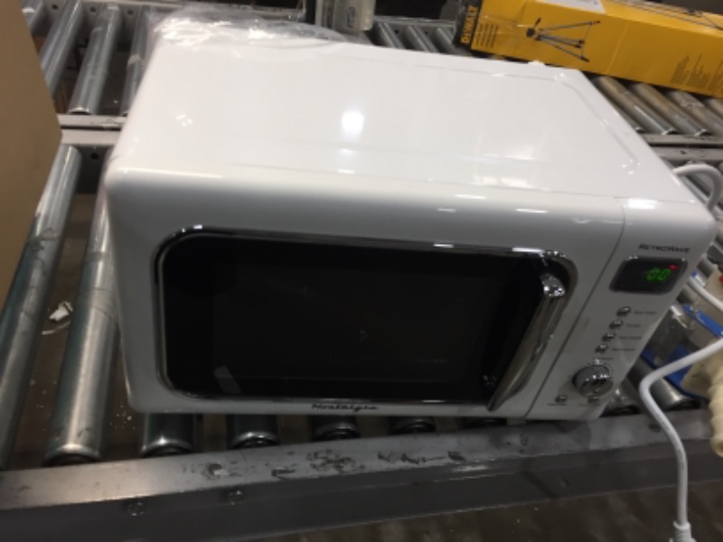 Photo 1 of Nostalgia CLMO7WH Classic Retro 0.7 Cu. Ft. 700-Watt Countertop Microwave Oven With LED Display, 5 Power Levels, 8 Cook Settings, White

