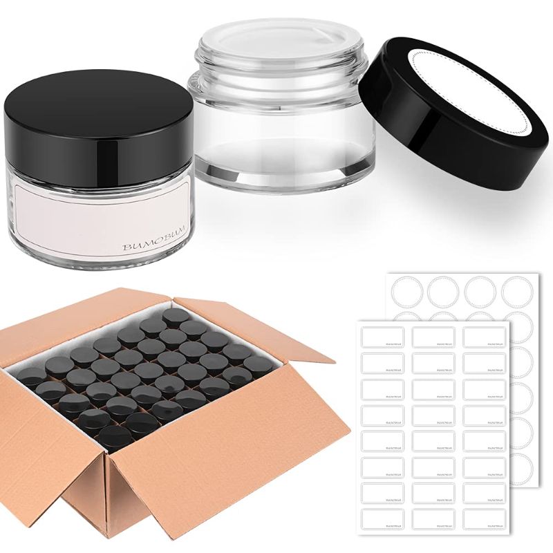 Photo 1 of 1 oz Round Clear Glass Jars, Bumobum 140 pack Cream Jars with Black Lids, Black and White Labels & Inner Liners, Empty Cosmetic Containers for Cream, Lotion
