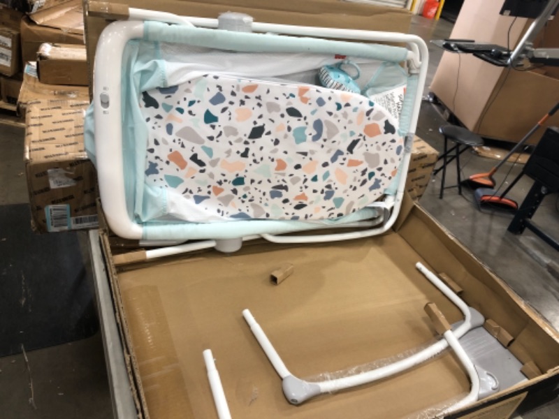 Photo 2 of Fisher-Price Rock with Me Bassinet Pacific Pebble, Portable Bassinet with Rocking Motion and Soothing Features for Newborns and Infants
