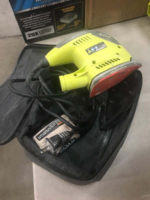 Photo 2 of *USED*
*MISSING sandpaper* 
RYOBI 1.2 Amp Corded 5.5 in. Corner Cat Sander with Dust Bag, Sample Sandpaper, and Storage Case