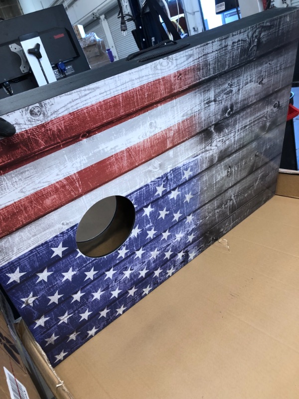 Photo 3 of *SEE last picture for damage* 
Wild Sports 2’x3’ Cornhole Outdoor Game Set, USA Flag MDF Wood with all-weather bean bags included – perfect for Backyard, Beach, Park, and Tailgates
