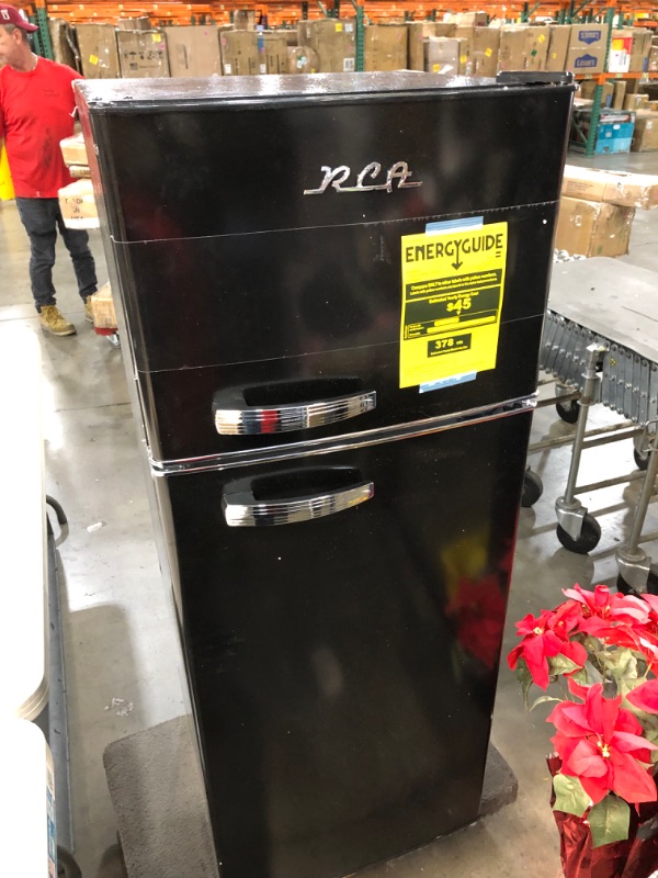 Photo 1 of *SEE last picture for damage*
RCA RFR786-BLACK 2 Door Apartment Size Refrigerator with Freezer, 7.5 cu. ft, Retro Black
