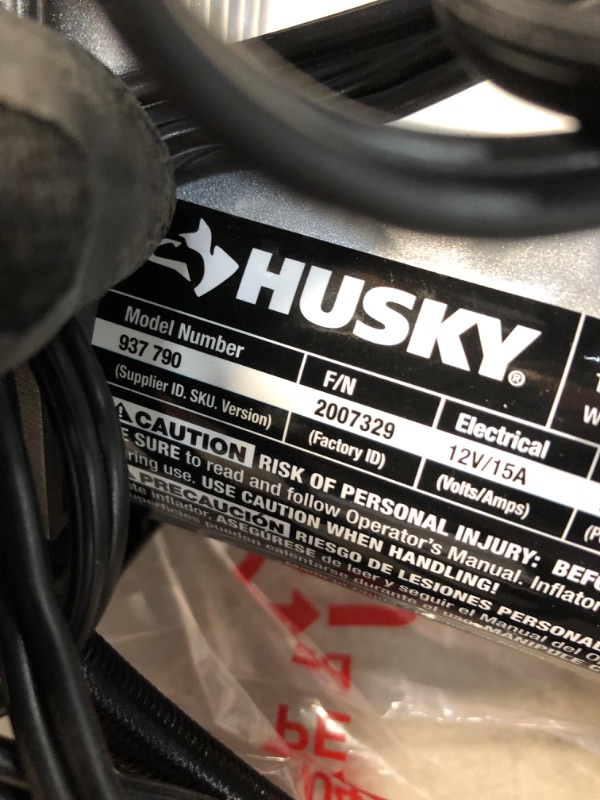 Photo 3 of *MISSING attachment pieces* 
Husky 12-Volt Inflator