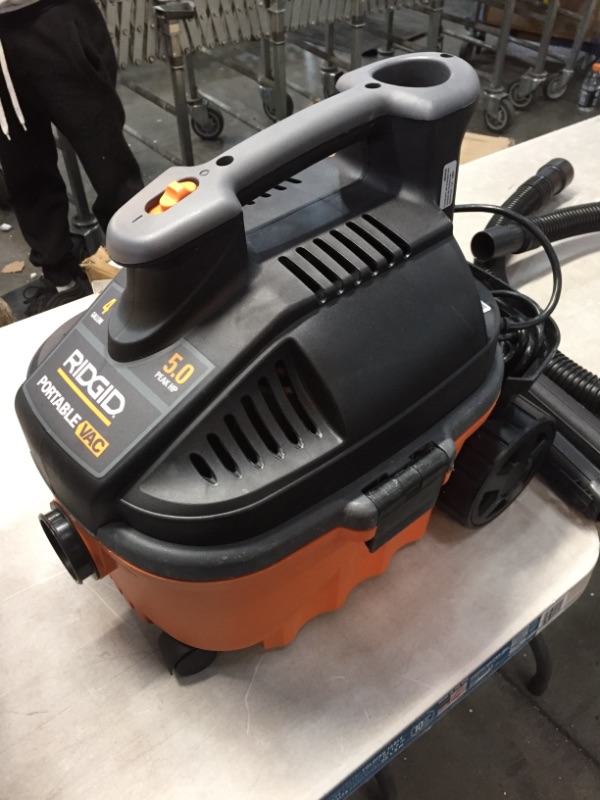 Photo 2 of *USED*
*MISSING filter and 1 accessory piece* 
RIDGID 4 Gallon 5.0-Peak HP Portable Wet/Dry Shop Vacuum with Fine Dust Filter, Hose and Accessories