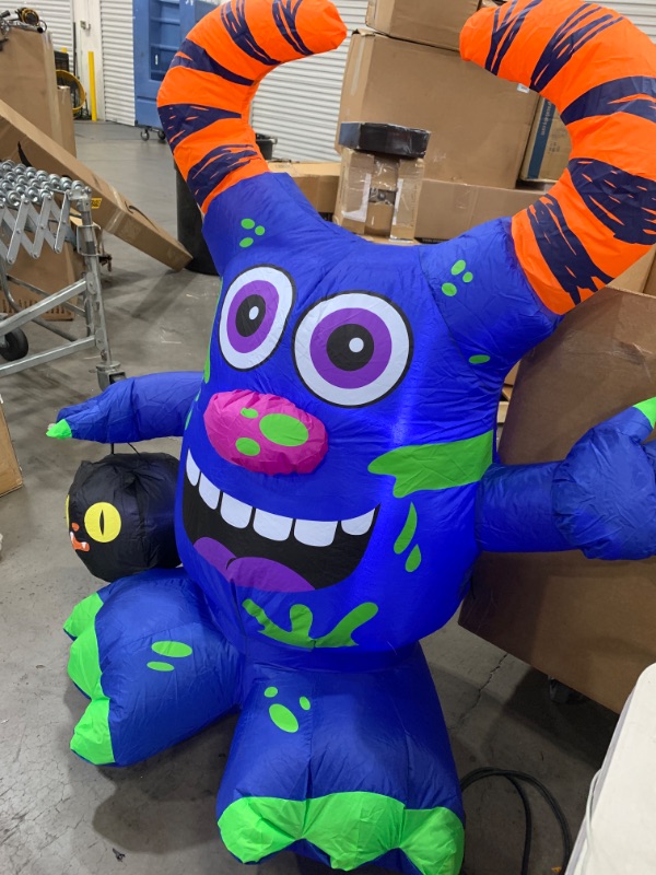 Photo 2 of 4.5 ft. Doodle Monster with Candy Bucket Airblown Halloween Inflatable
