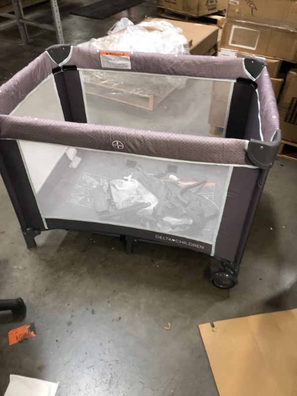 Photo 2 of Delta Children LX Deluxe Portable Baby Play Yard With Removable Bassinet and Changing Table, Eclipse
