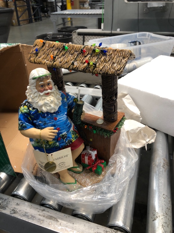 Photo 2 of 
Kurt S. Adler 11" Beach Santa at Tiki Bar Figure, Brown