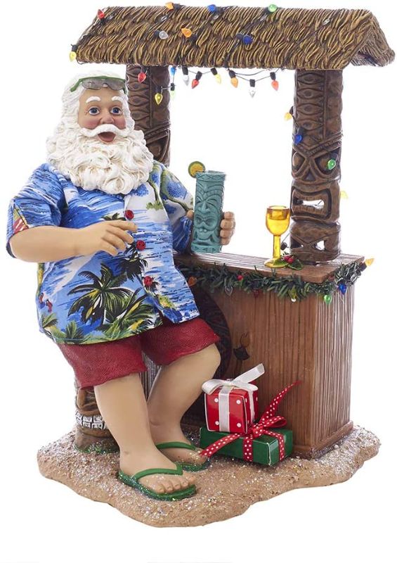 Photo 1 of 
Kurt S. Adler 11" Beach Santa at Tiki Bar Figure, Brown