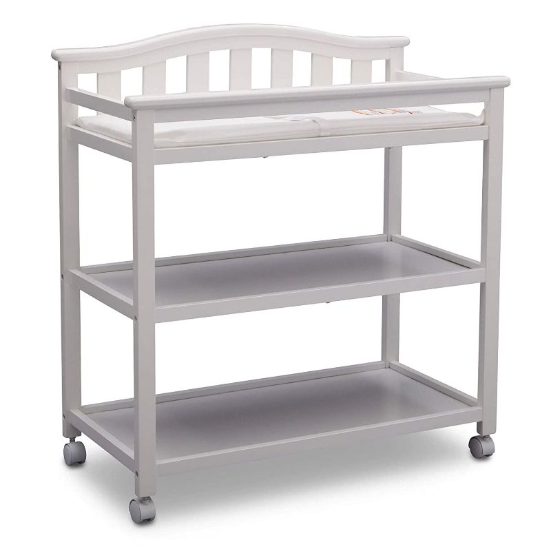 Photo 1 of Delta Children Bell Top Changing Table with Wheels and Changing Pad, White
