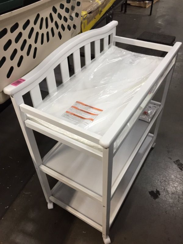 Photo 2 of Delta Children Bell Top Changing Table with Wheels and Changing Pad, White
